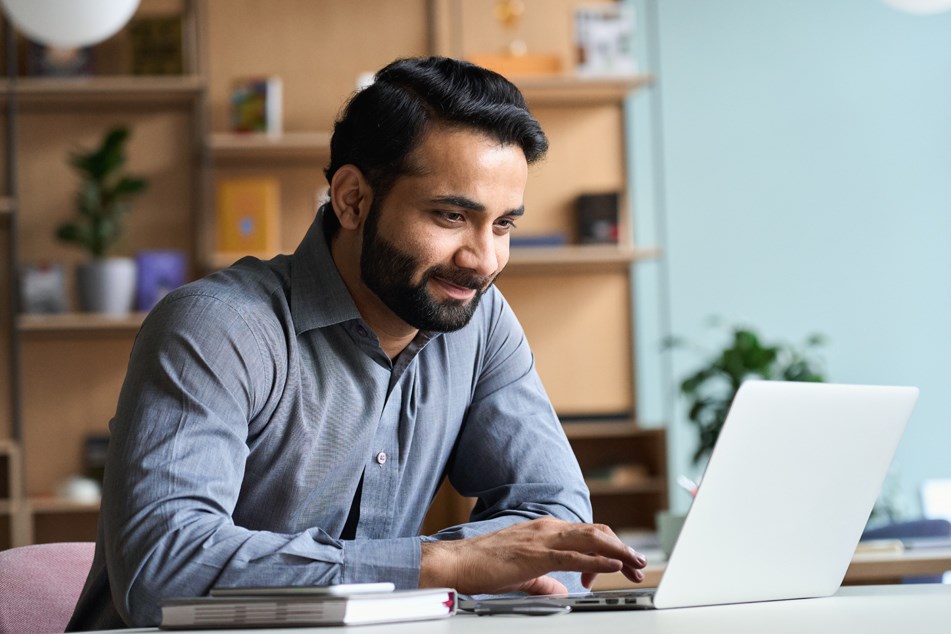 Individual working on laptop