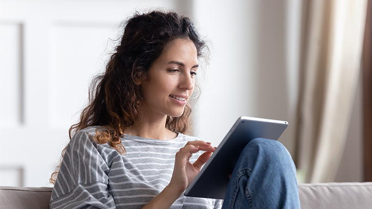 woman using the net price calculator on her tablet