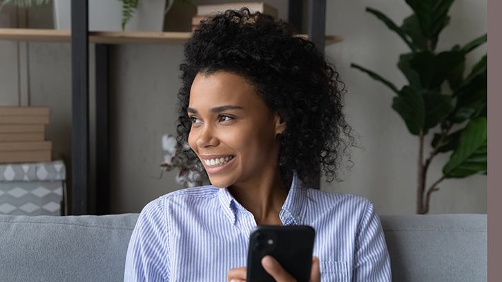 Woman using her phone to access swiftMD benefits